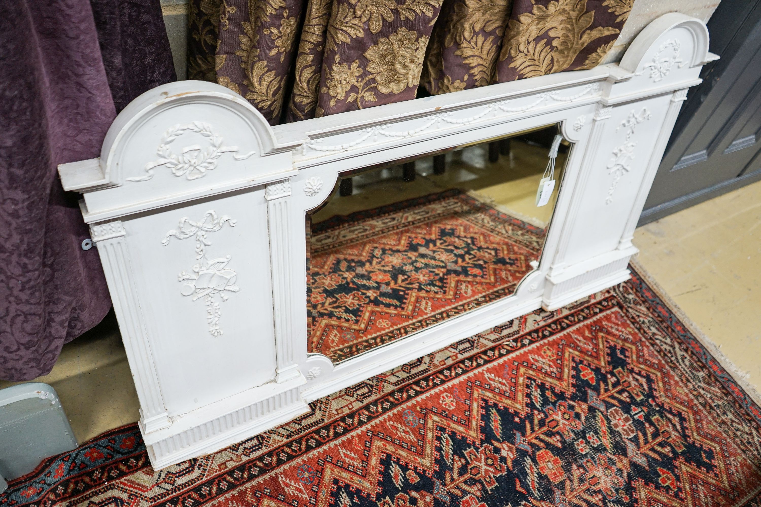 A Victorian later painted overmantel mirror, width 143cm, height 76cm together with a painted and mirrored overmantel